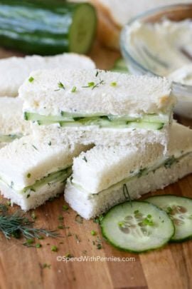 Cucumber Sandwich pieces on a wooden board