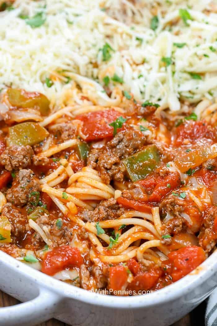 Baked Spaghetti in baking dish with cheese on top