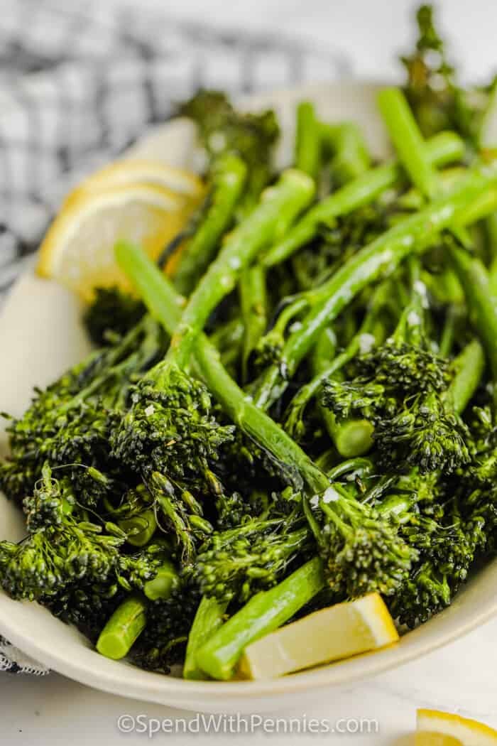 Air Fryer Broccolini on a plate with lemon