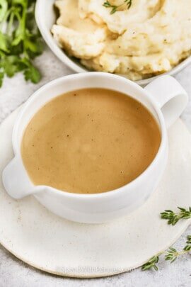 Turkey neck gravy in a white gravy boat