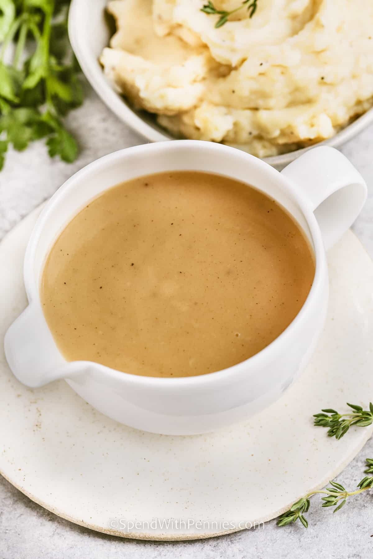 Turkey neck gravy in a white gravy boat