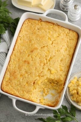 baked corn casserole in a white baking dish