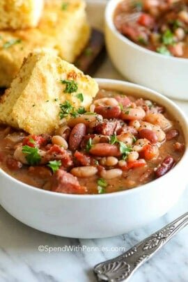 tasty Crock Pot Ham and Bean Soup in a bowl with cornbread